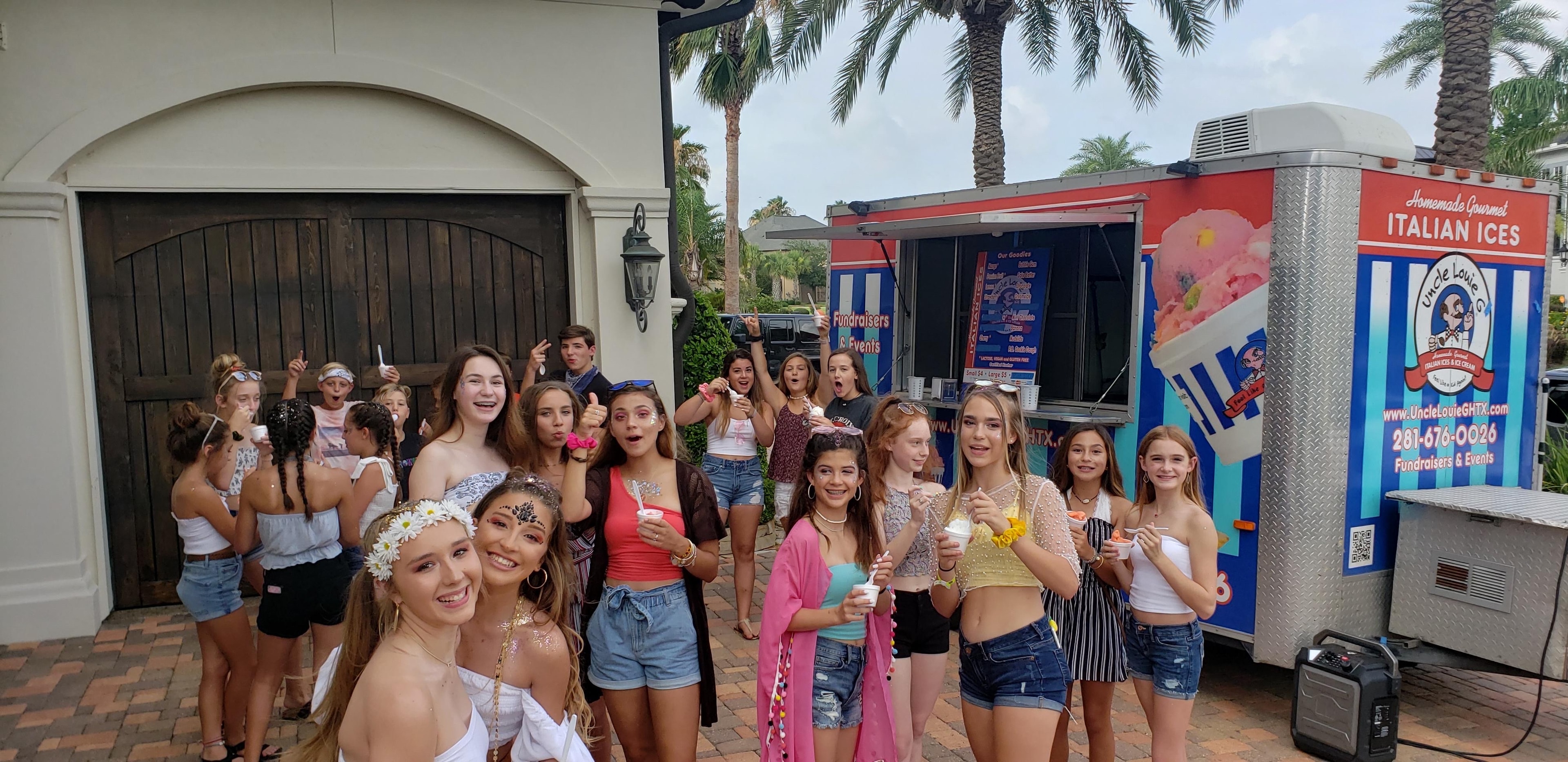 Uncle Louie G's team serving Italian ice at an event